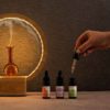 Artistic shot of our Aurora waterless diffuser with a trio of Eternal Sunshine essential oil blends