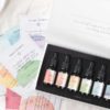 A square view of seven chakra essential oil blend gift box